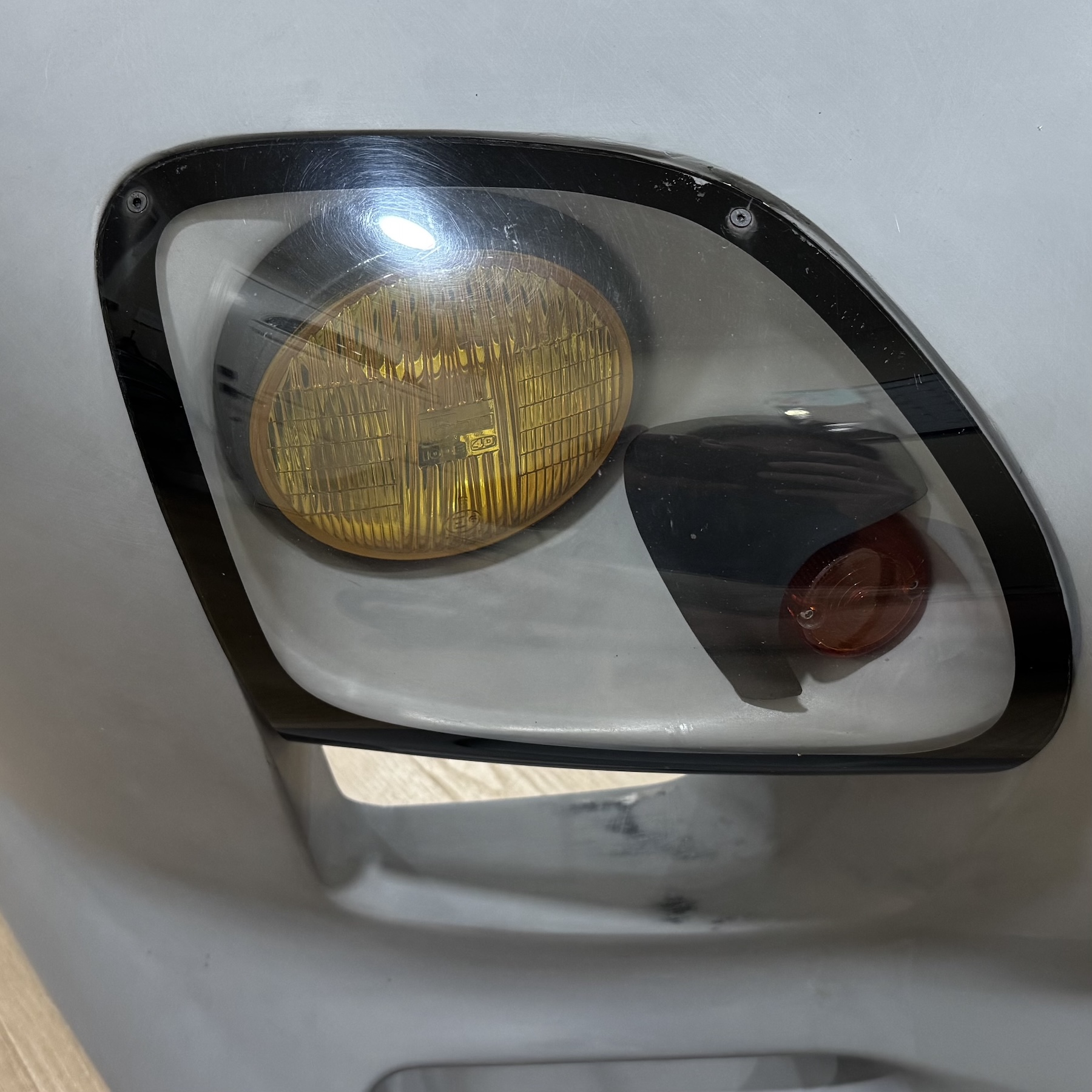 Standard turn signal shroud installed with lens